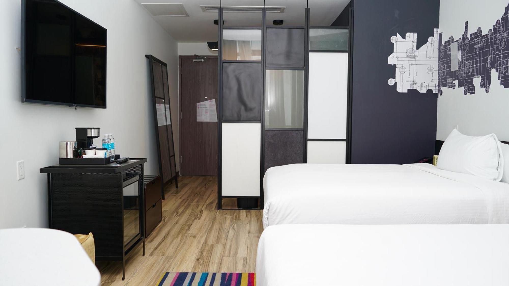 Guest Room with Two Queen Beds and Balcony